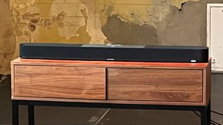 Sennheiser Ambeo Plus soundbar on wooden stand