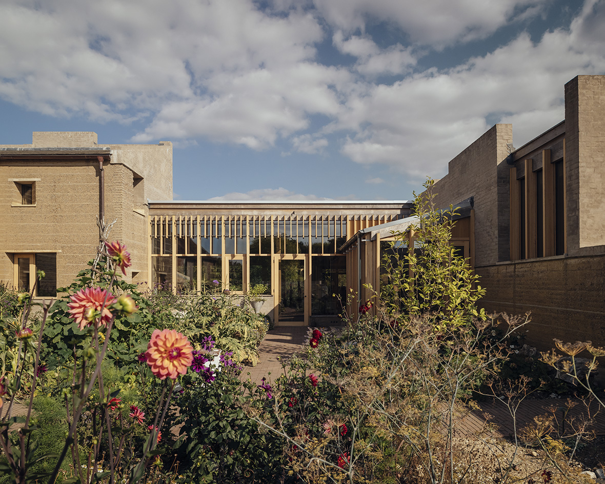 view of Rammed Earth House by Tuckey Design Studio with tactile walls and earth tones