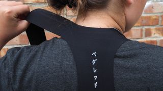 Detail of rear shoulder straps of Pedaled Odyssey Women's Cargo Bib Tights