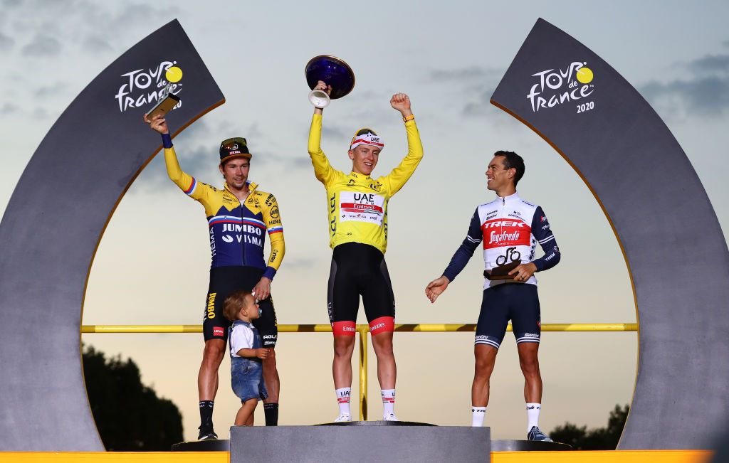 PARIS FRANCE SEPTEMBER 20 Podium Primoz Roglic of Slovenia and Team Jumbo Visma with his son Levom Tadej Pogacar of Slovenia and UAE Team Emirates Yellow Leader Jersey Richie Porte of Australia and Team Trek Segafredo Celebration Trophy Mask Covid safety measures during the 107th Tour de France 2020 Stage 21 a 122km stage from MantesLaJolie to Paris Champslyses TDF2020 LeTour on September 20 2020 in Paris France Photo by Michael SteeleGetty Images