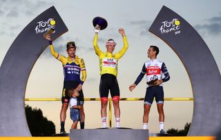 PARIS FRANCE SEPTEMBER 20 Podium Primoz Roglic of Slovenia and Team Jumbo Visma with his son Levom Tadej Pogacar of Slovenia and UAE Team Emirates Yellow Leader Jersey Richie Porte of Australia and Team Trek Segafredo Celebration Trophy Mask Covid safety measures during the 107th Tour de France 2020 Stage 21 a 122km stage from MantesLaJolie to Paris Champslyses TDF2020 LeTour on September 20 2020 in Paris France Photo by Michael SteeleGetty Images