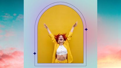 woman in delight raising her arms over yellow background and sky background