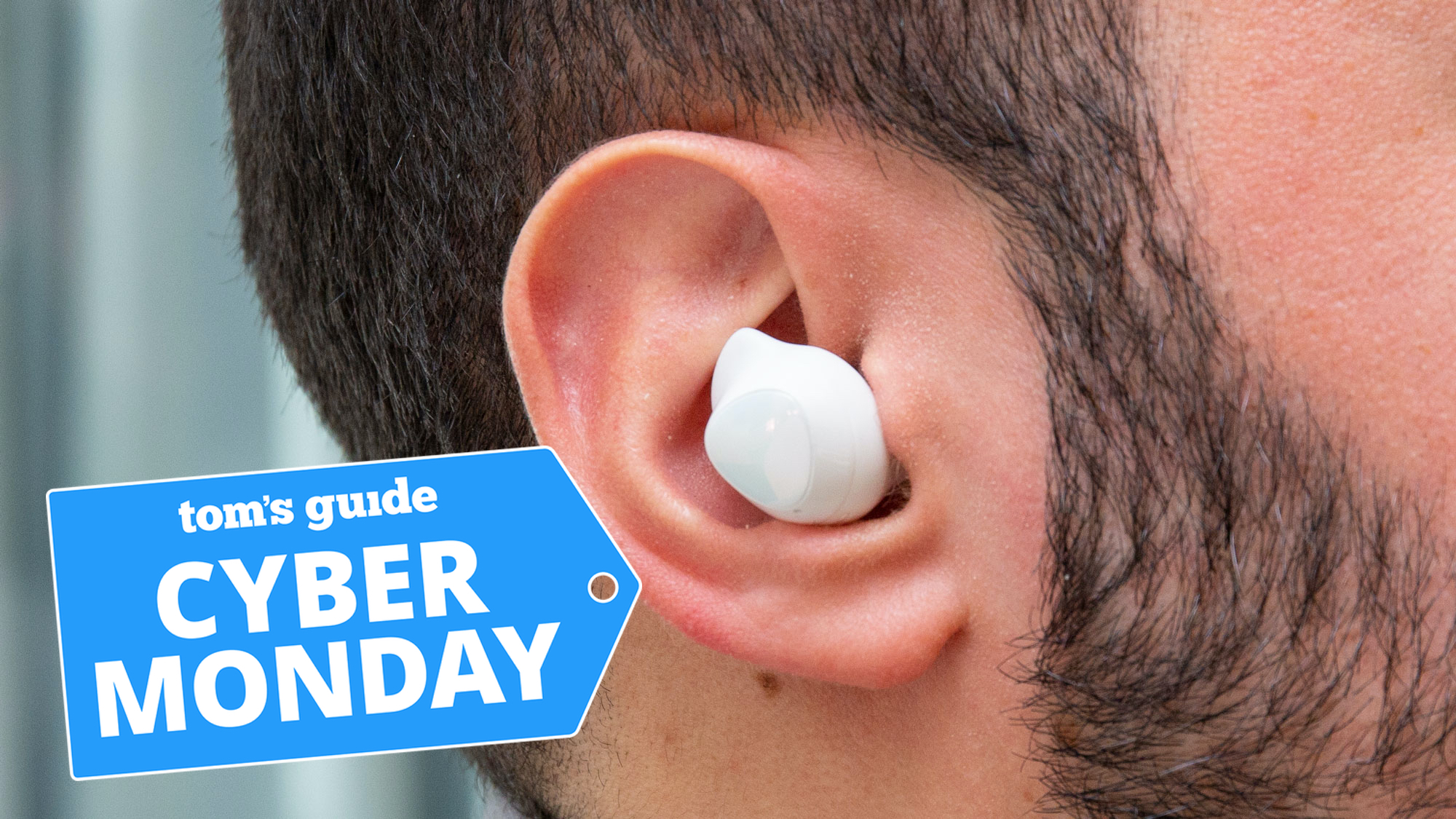 Galaxy Buds Plus in the ear of a man, with Cyber Monday badge in image.