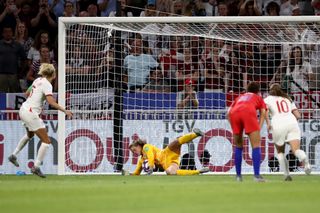 Alyssa Naeher of the USA saves a penalty from Steph Houghton of England during the 2019 FIFA Women's World Cup France Semi Final match between England and USA at Stade de Lyon on July 02, 2019 in Lyon, France.