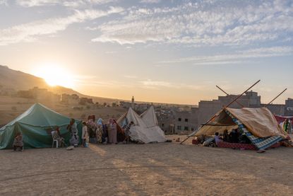 Villagers in Morocco camp outsie