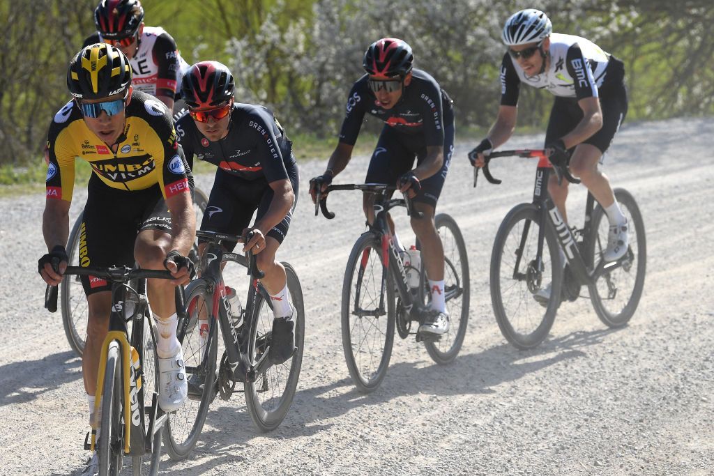 SIENA ITALY MARCH 06 Wout Van Aert of Belgium and Team Jumbo Visma Thomas Pidcock of United Kingdom Egan Arley Bernal Gomez of Colombia and Team INEOS Grenadiers Michael Gogl of Austria and Team Qhubeka Assos during the Eroica 15th Strade Bianche 2021 Mens Elite a 184km race from Siena to Siena Piazza del Campo Gravel Strokes Breakaway Dust StradeBianche on March 06 2021 in Siena Italy Photo by Tim de WaeleGetty Images