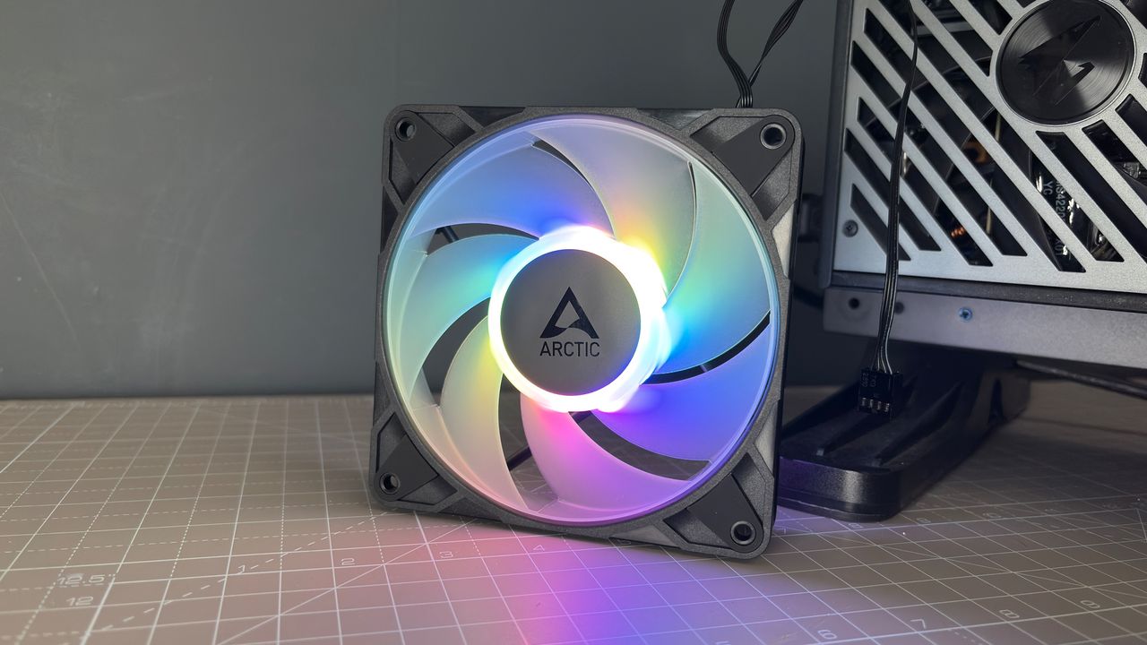Various PC fans on a table with testing equipment for a round of batch tests.