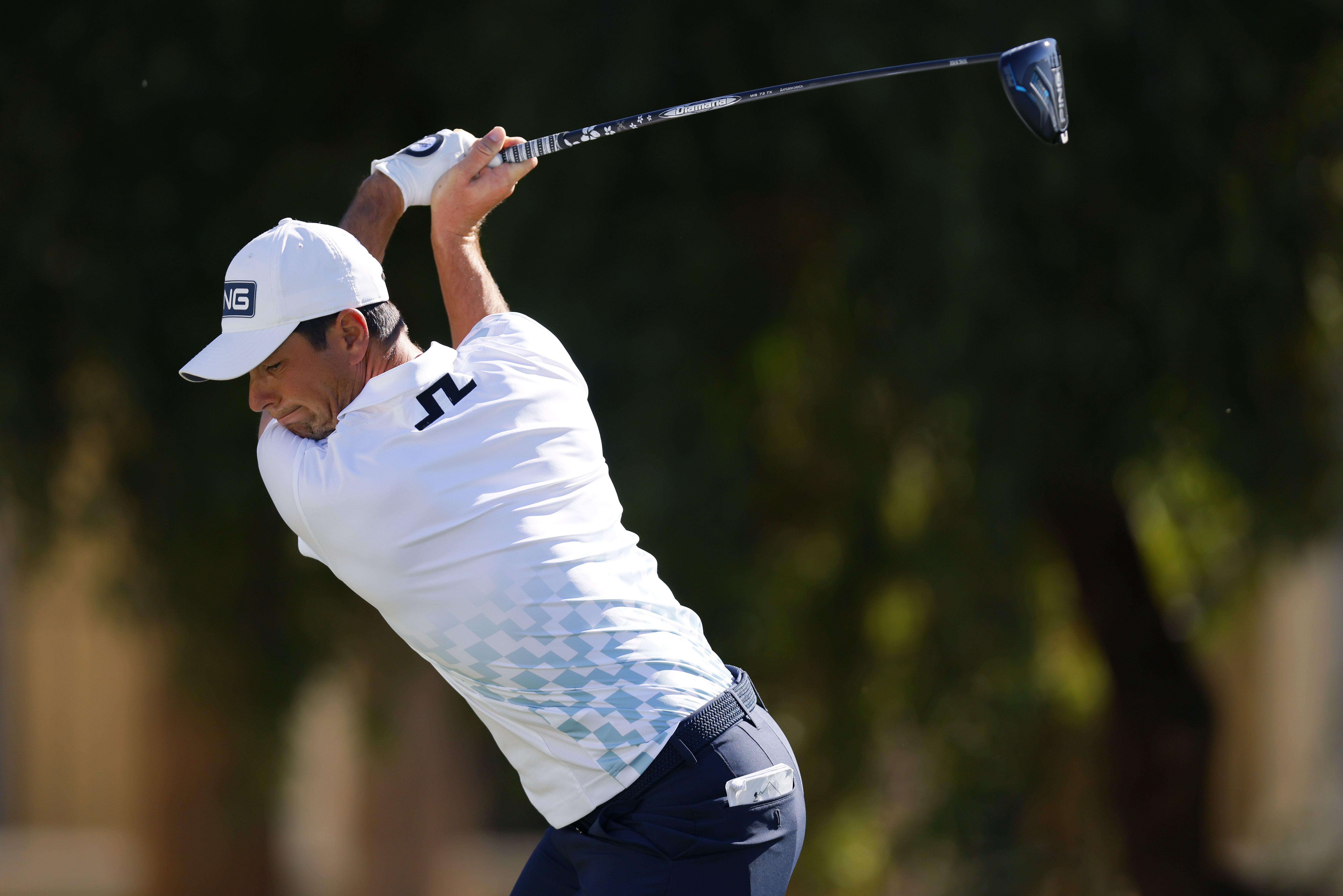 Viktor Hovland hits a driver off the tee