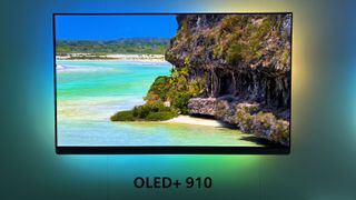 A wall-mounted Philips OLED910 with a coastal scene on screen