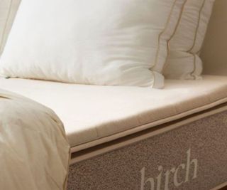 Birch Plush Mattress Topper on a bed.