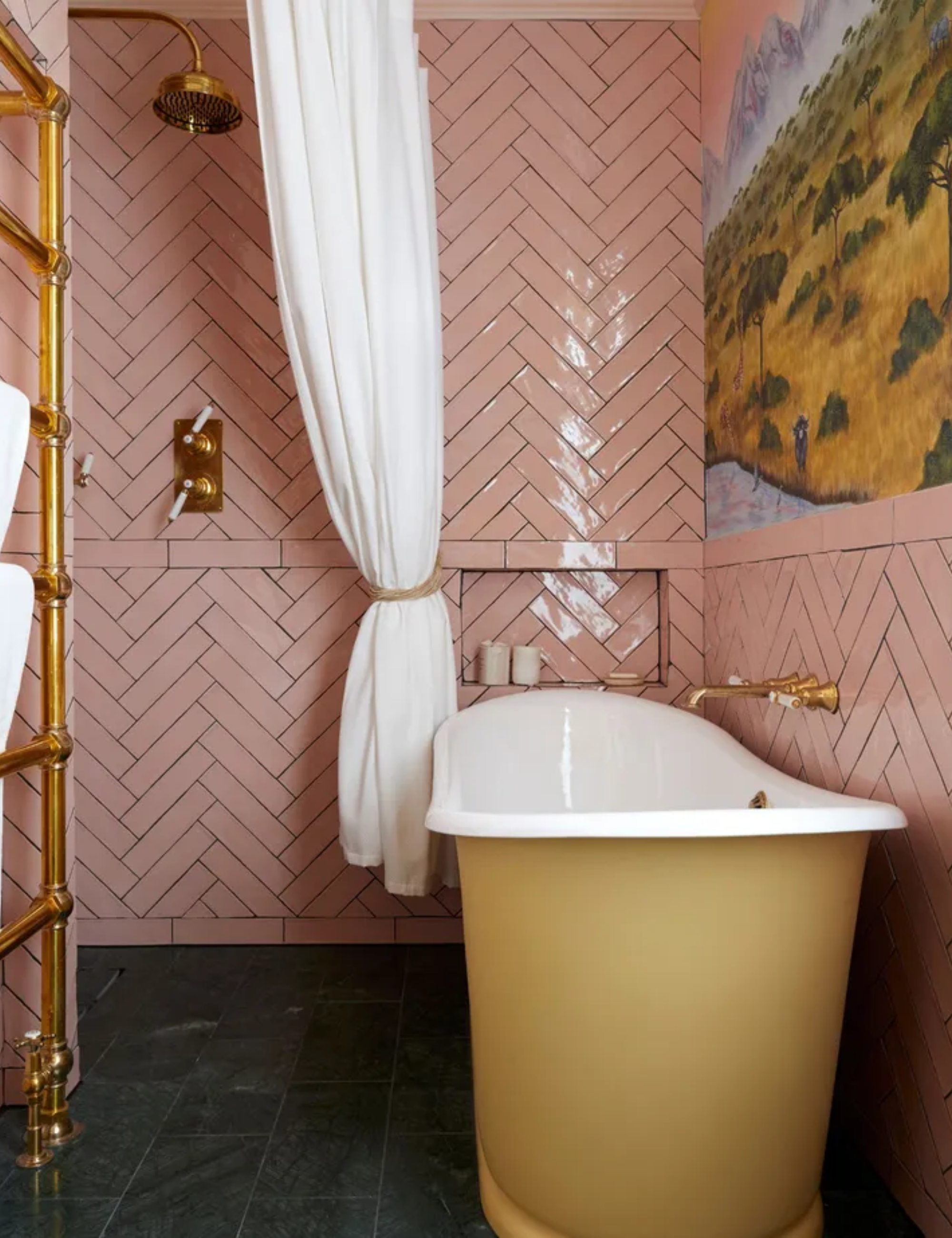 Pink bathroom, yellow bath tub, gold fixtures