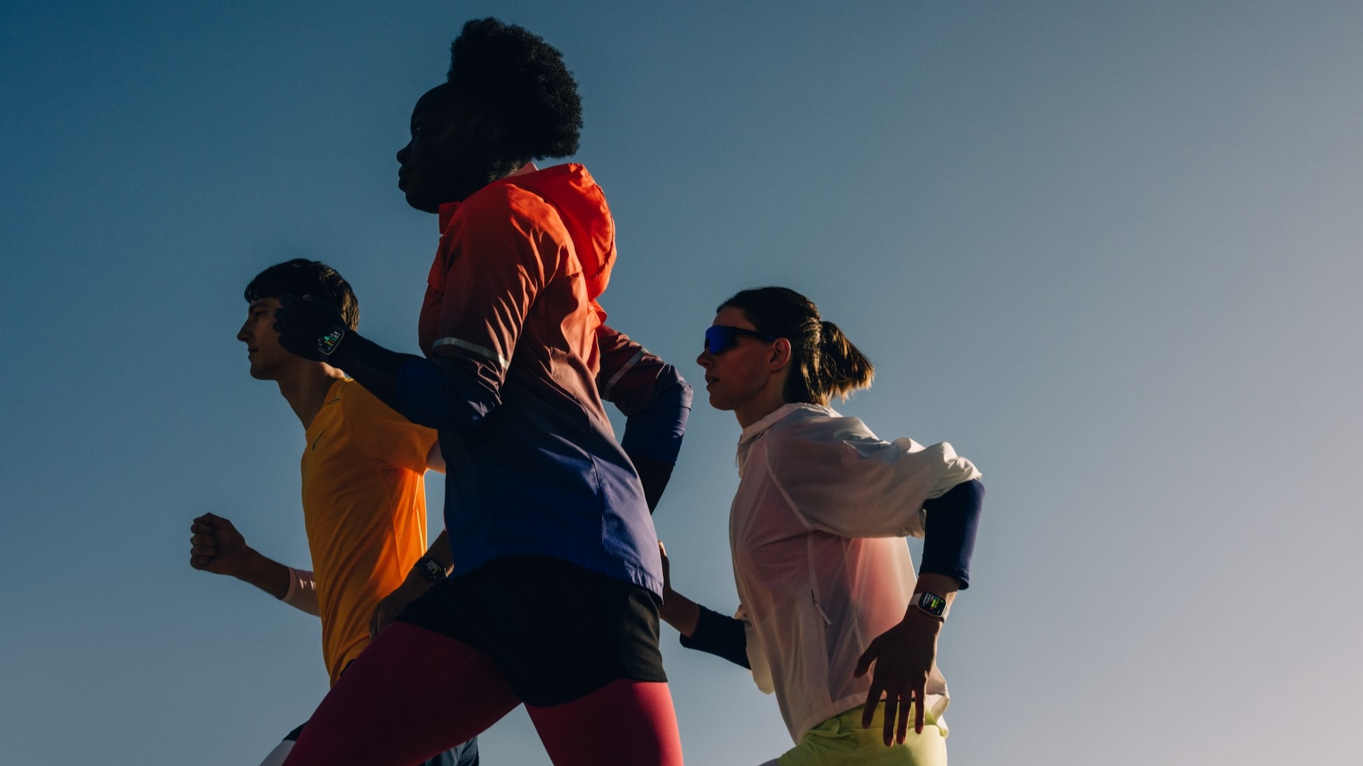 Three people running