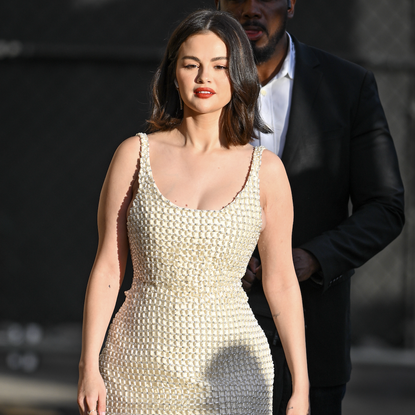 Selena Gomez is seen arriving at 'Jimmy Kimmel Live!' on January 6, 2025 in Los Angeles, California wearing two brial-inspired white dresses