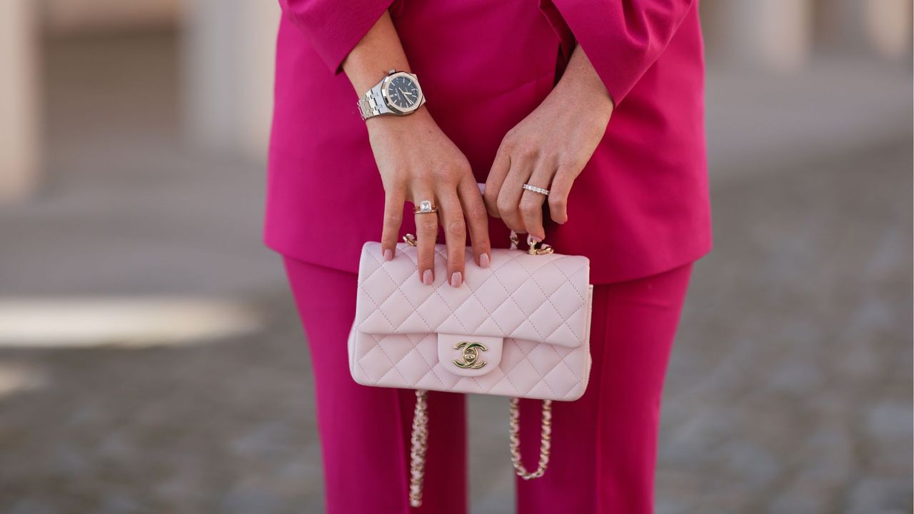 Leo Eberlin wearing an engagement ring and pink manicure