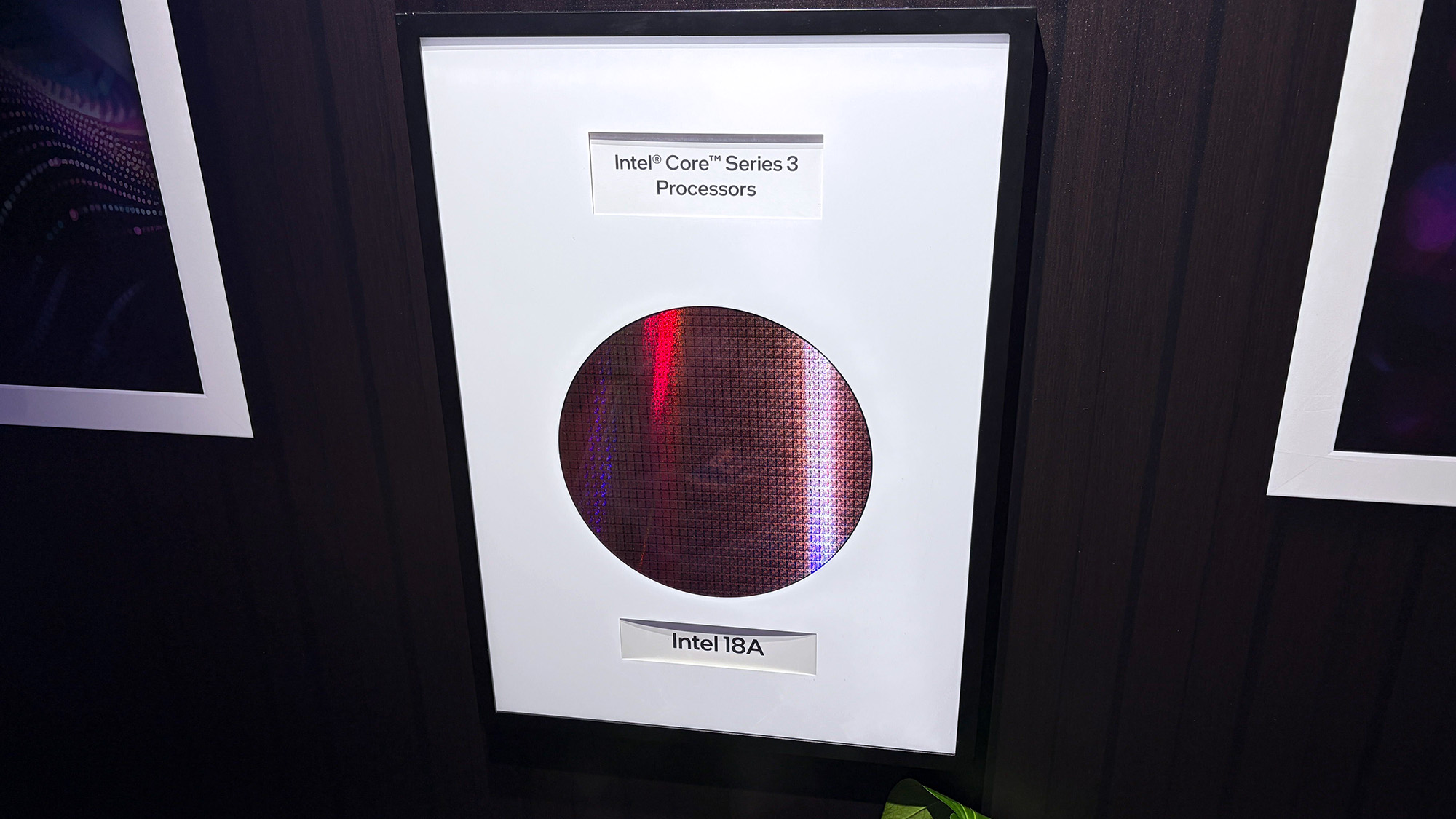 Intel Core Ultra Series 3 processor wafer displayed in a frame with "Intel 18A"