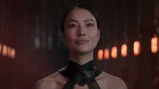 Kitana smirking in the throne room in Mortal Kombat II 