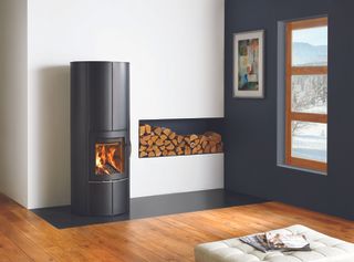 simple black steel woodburning stove from lotus