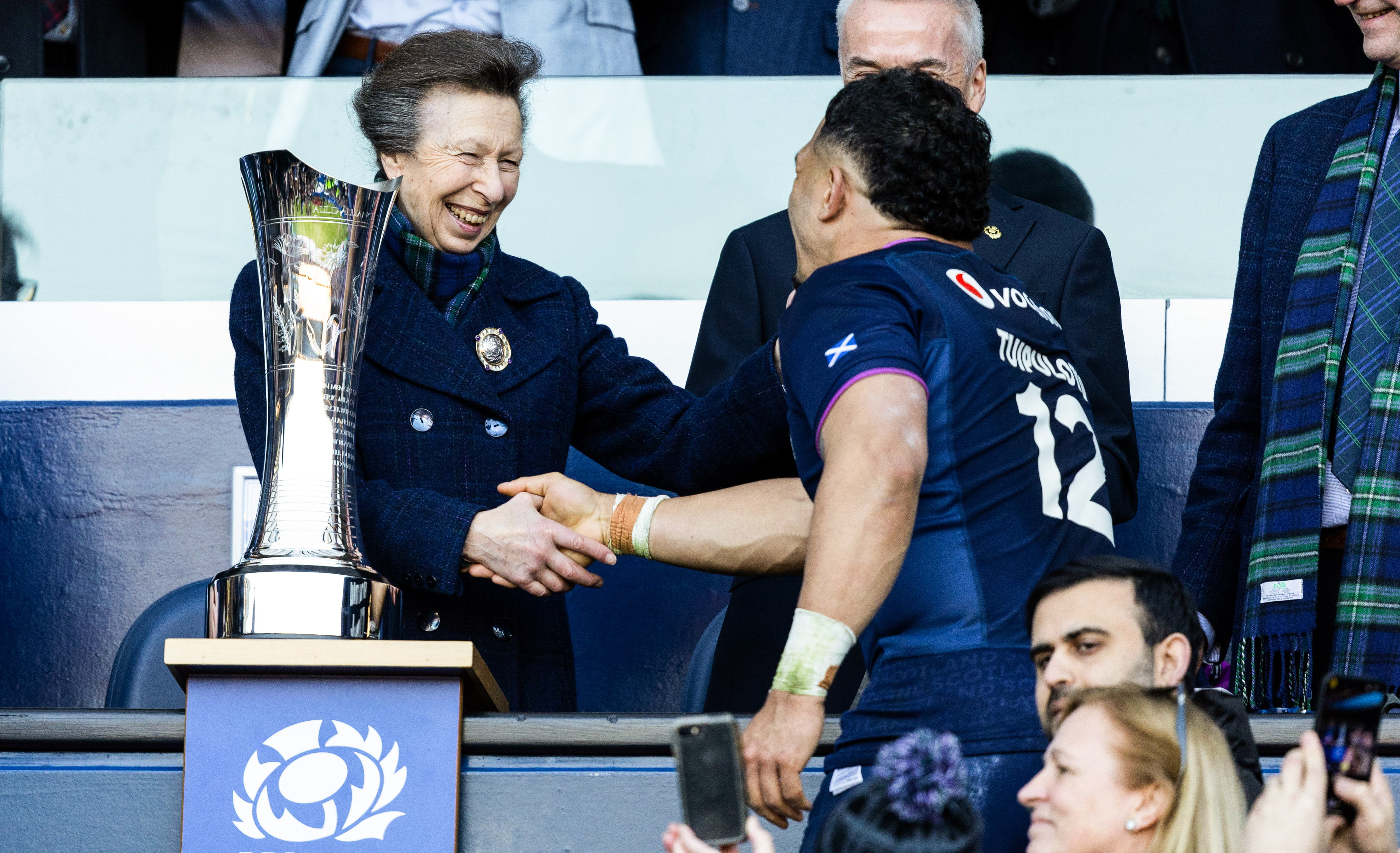 Princess Anne shaking hands with a rugby player