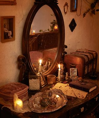 Interior of the Hocus Pocus Airbnb - antique dressing table with old trays and candles