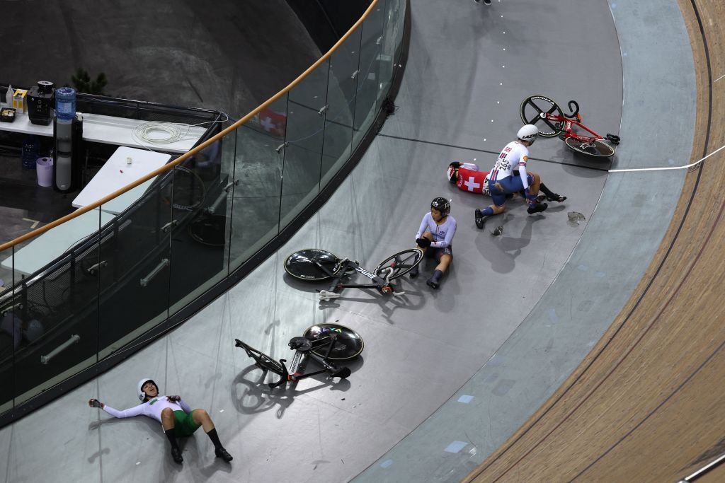 Switzerlands Michelle Andres Great Britains Sophie Lewis Mexicos Yareli Acevedo Mendoza and Japans Yumi Kajihara suffer a crash as they compete in the Womens Elimination finals during the UCI Track Cycling World Championships at the Velodrome of SaintQuentinenYvelines southwest of Paris on October 13 2022 Photo by Thomas SAMSON AFP Photo by THOMAS SAMSONAFP via Getty Images