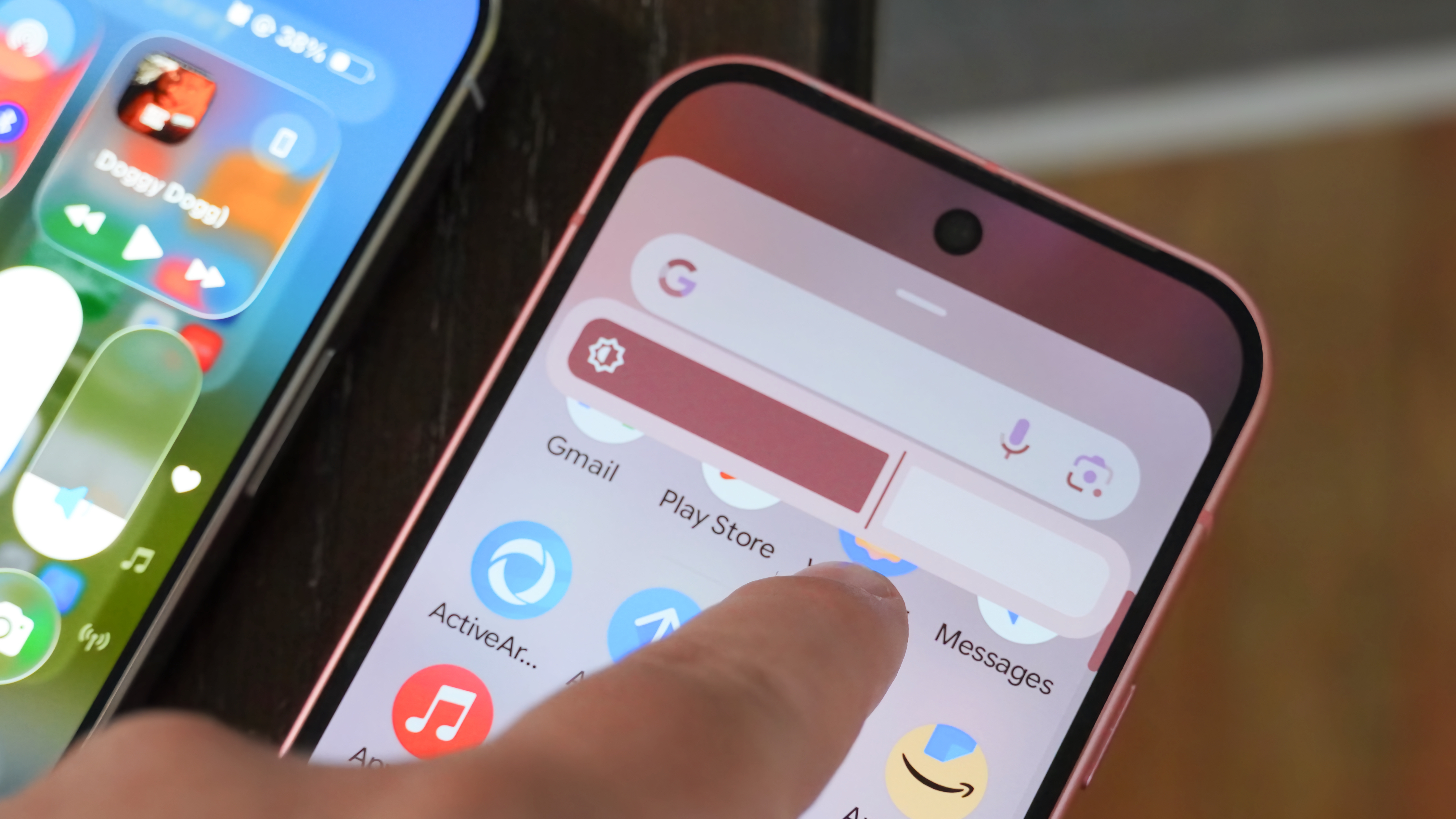 A comparison of UI sliders in iOS 16's Liquid Glass and Android 16's Material 3 Expressive.