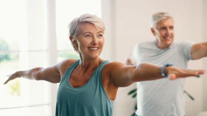 Senior couple exercise at home