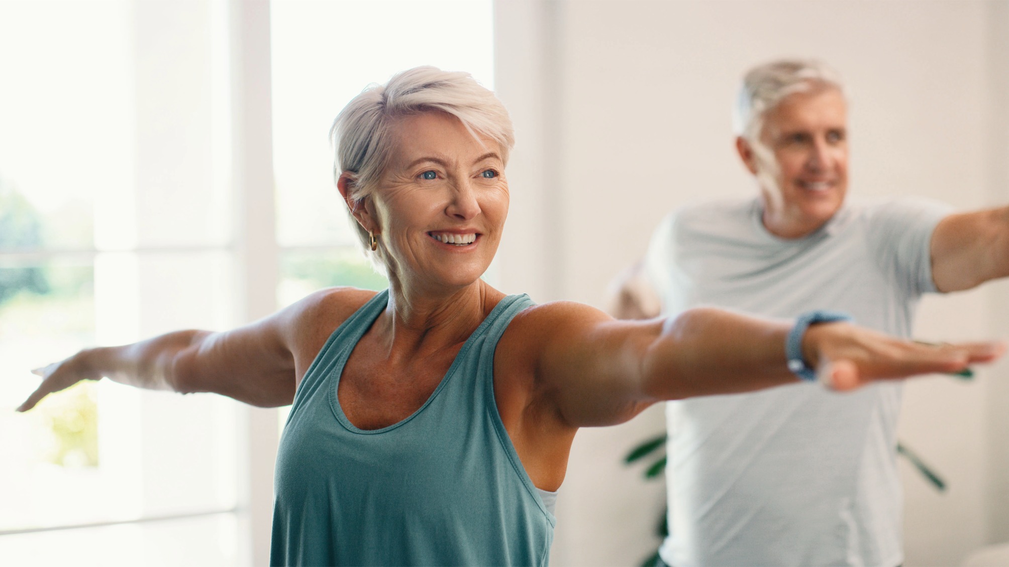 Senior couple exercise at home