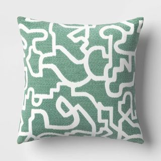 green and white geometric cushion