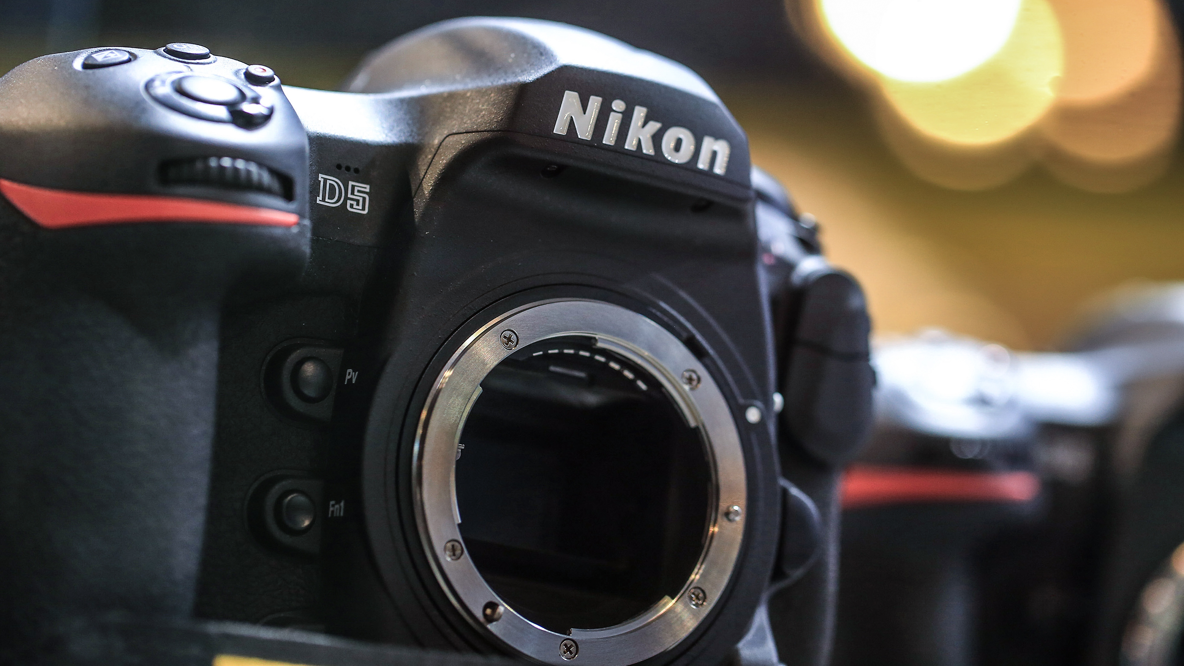 A Nikon Corp. D5 digital single lens reflex (DSLR) camera body sits on display at the Nikon stand, during the Photokina photography trade fair in Cologne, Germany, on Tuesday, Sept. 20, 2016. Photokina imaging trade fair takes place from September 20-25. Photographer: Krisztian Bocsi/Bloomberg via Getty Images
