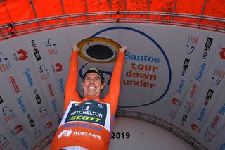 Daryl Impey celebrates victory on the final overall podium at the Tour Down Under