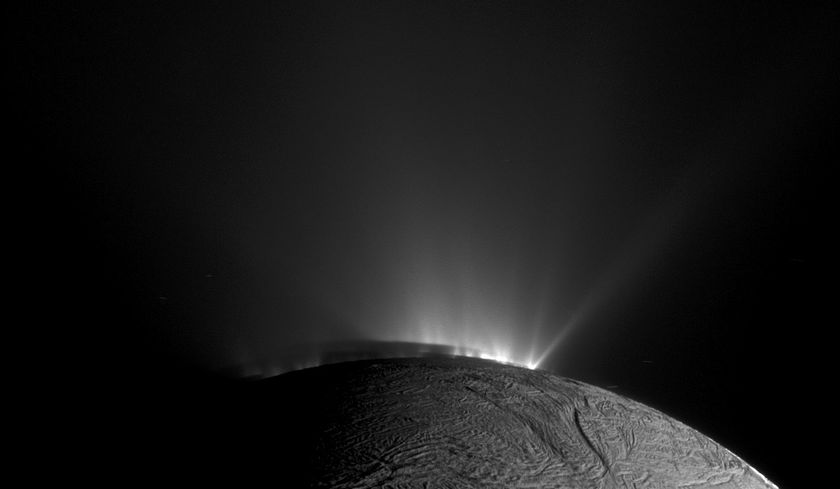 Jets of water from the Enceladus&#039; underground ocean bursting through cracks in the ice