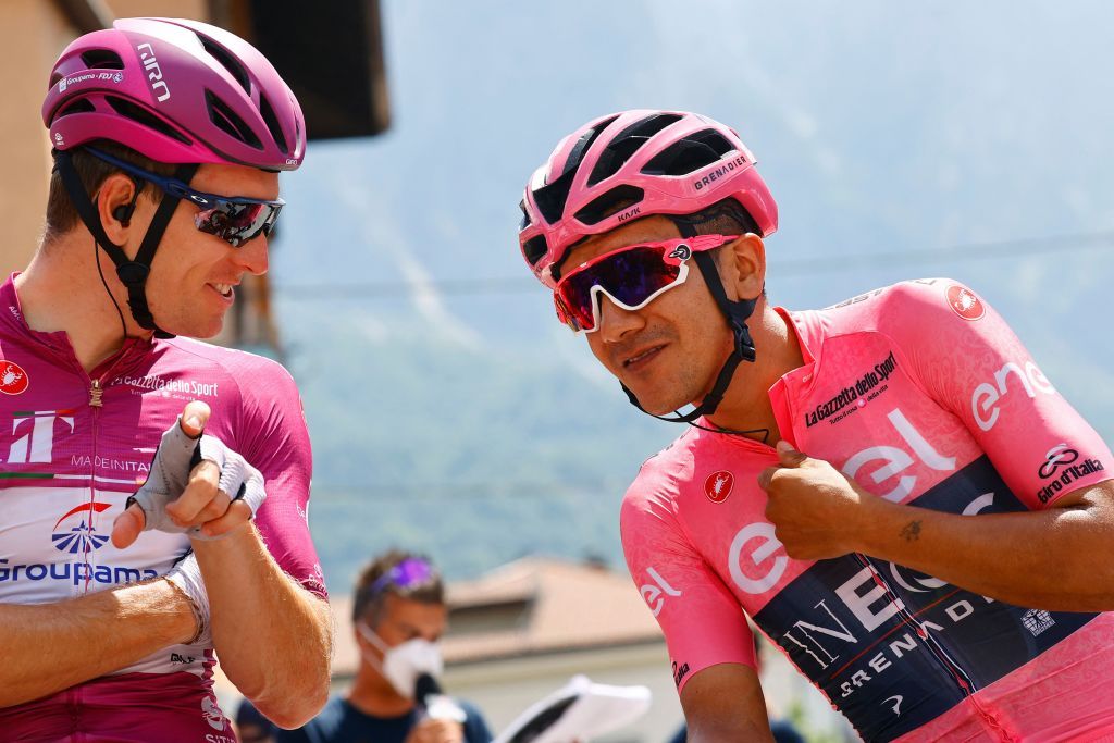 Team Ineos Ecuadorian rider Richard Carapaz R wearing the overall leaders pink jersey talks with Team GroupamaFDJs French rider Arnaud Demare L prior to the start of the 18th stage of the Giro dItalia 2022 cycling race 156 km from Borgo Valsugana to Treviso on May 26 2022 Photo by Luca Bettini AFP Photo by LUCA BETTINIAFP via Getty Images