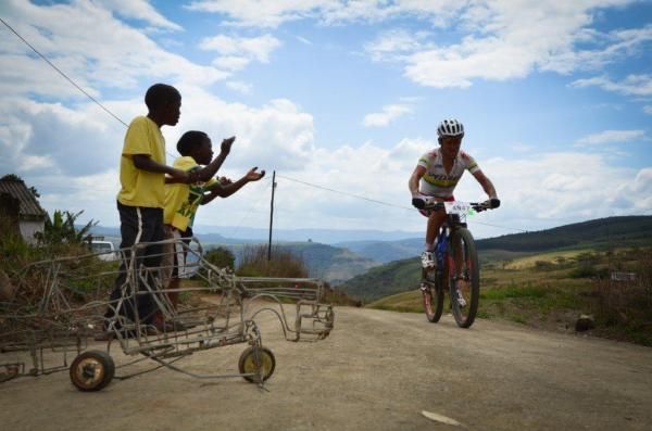 Burry Stander passes some local fans on his way to the win