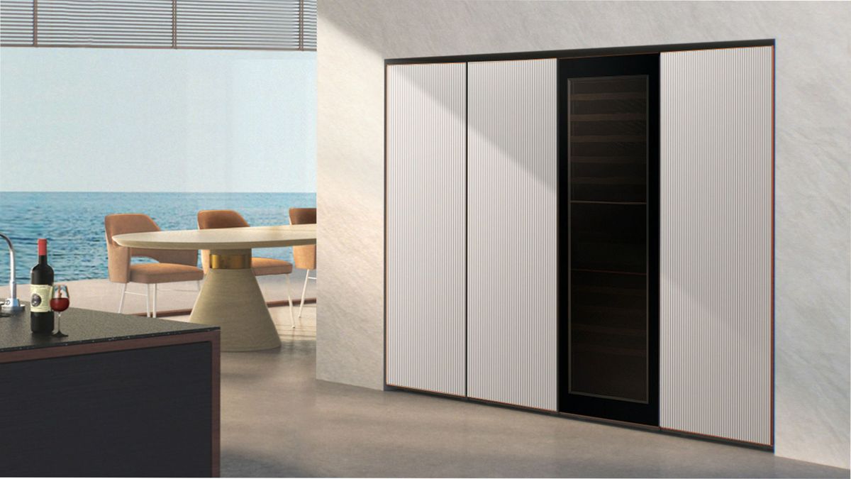 Image shows the Samsung fridge with wine cooler in a kitchen.