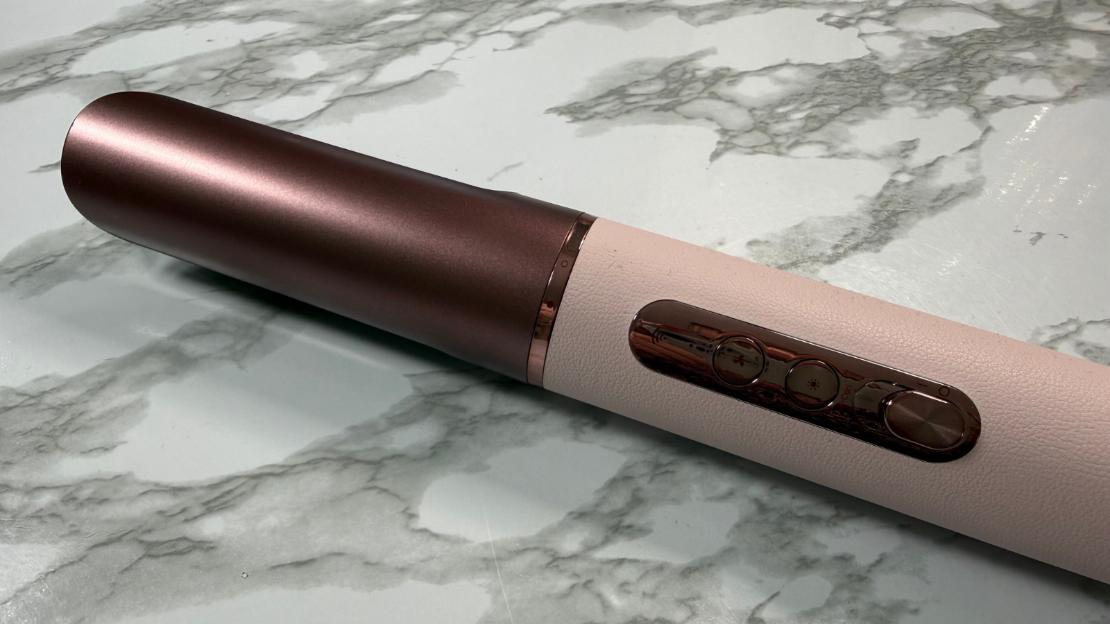 Dreame AirStyle Era fitted with the straightening nozzle attachment on a marble-effect surface