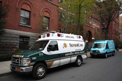 Two ambulances sit parked outside the Cobble Hill Health Center