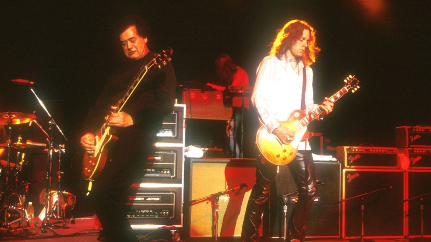 Jimmy Page (left) and Rich Robinson perform onstage at the Greek Theatre in Los Angeles in 1999