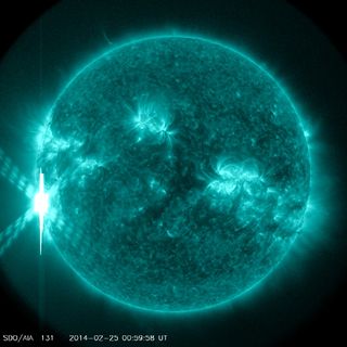 A giant solar flare, an X4.9-class sun storm, erupts from the sun at 00:49 GMT on Tuesday, Feb. 25 (7:49 p.m. Monday, Feb. 24 EST). This image of the flare was captured by NASA's sun-watching Solar Dynamics Observatory.