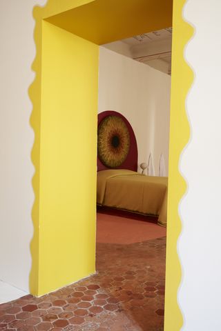 A doorway with bright yellow frame