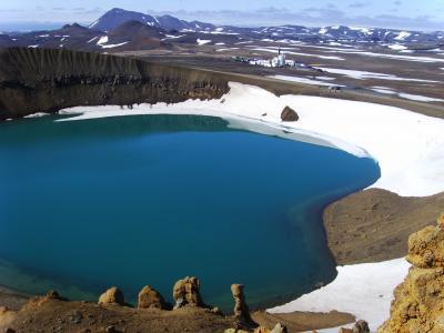 This is a view of the Krafla volcano, Iceland, across the explosion crater Viti that erupted in 1787, showing the drilling rig. The borehole encountered molten rock at 6,500 feet depth.