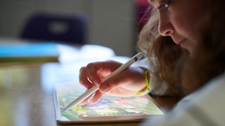 Woman drawing artwork with Apple Pencil