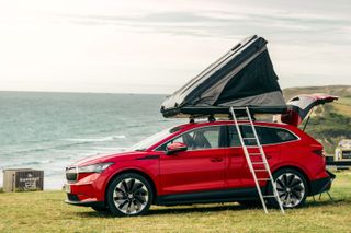 Škoda Enyaq iV 80 FestEVal with rooftop tent and ladder, at the coast
