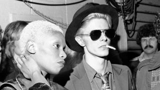 David Bowie and Ava Cherry watching a live show from the audience