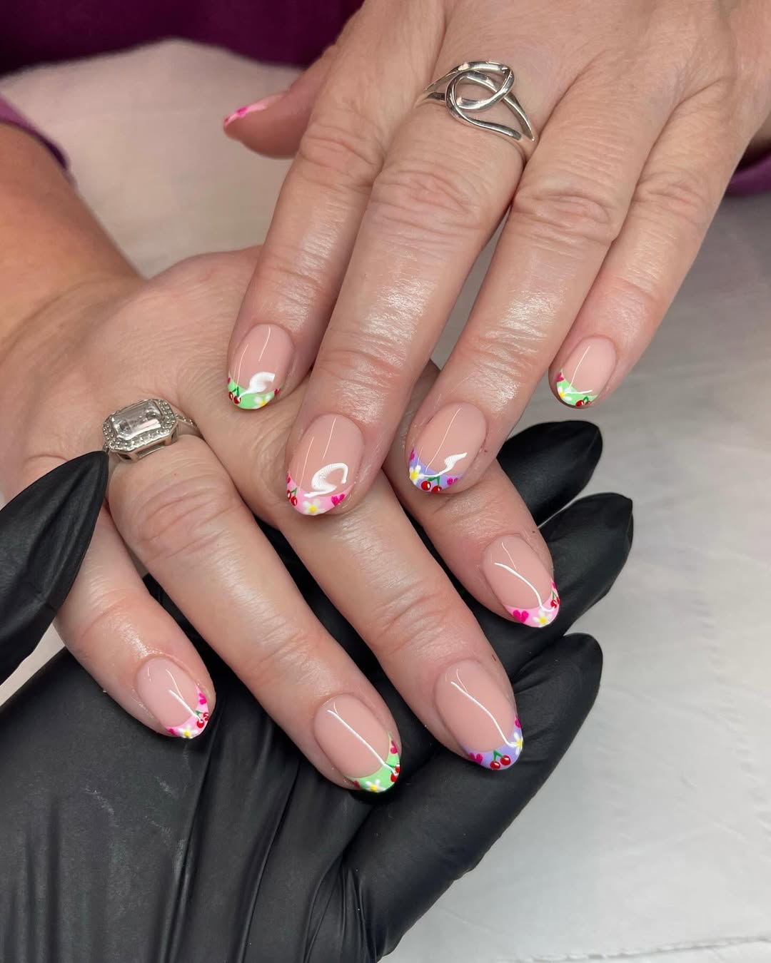 Cherry nail art on short French tip nails