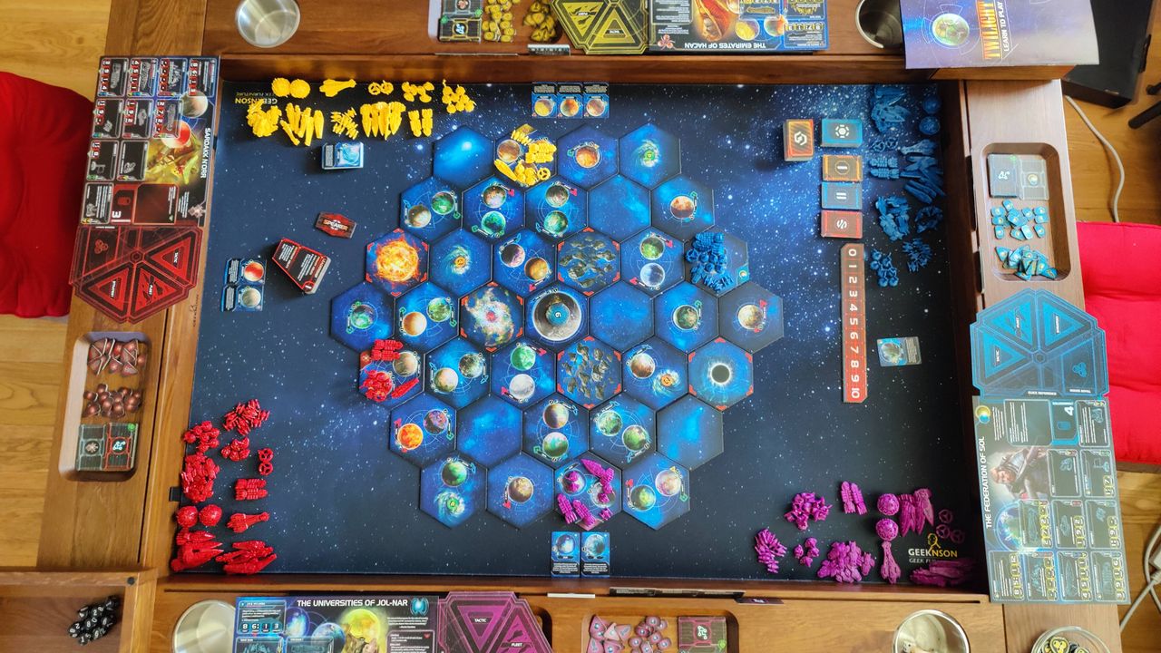 A top-down view of the Twilight Imperium board, complete with cards and tokens