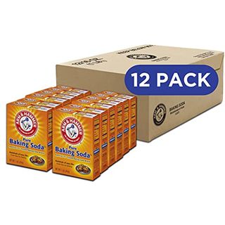 12 orange boxes of Arm & Hammer Baking Soda lined up 6 by 2