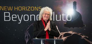 Astrophysicist Brian May, the lead guitarist of Queen, speaks with reporters ahead of NASA's New Horizons flyby of the Kuiper Belt Object Ultima Thule on Jan. 1, 2019 at the Johns Hopkins Applied Physics Laboratory in Laurel, Maryland. May composed a special song just for the flyby.