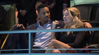 Will Smith and Margot Robbie (L-R) sitting together in "Focus" (2015)