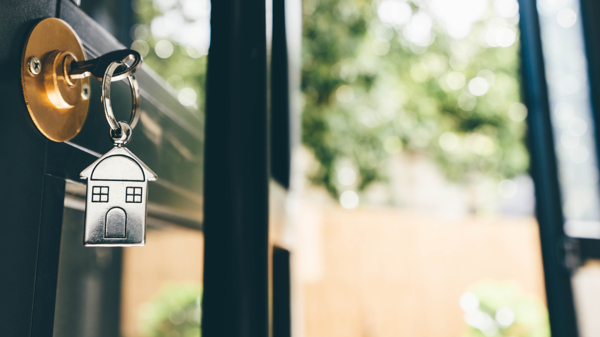 House key unlocking a door 