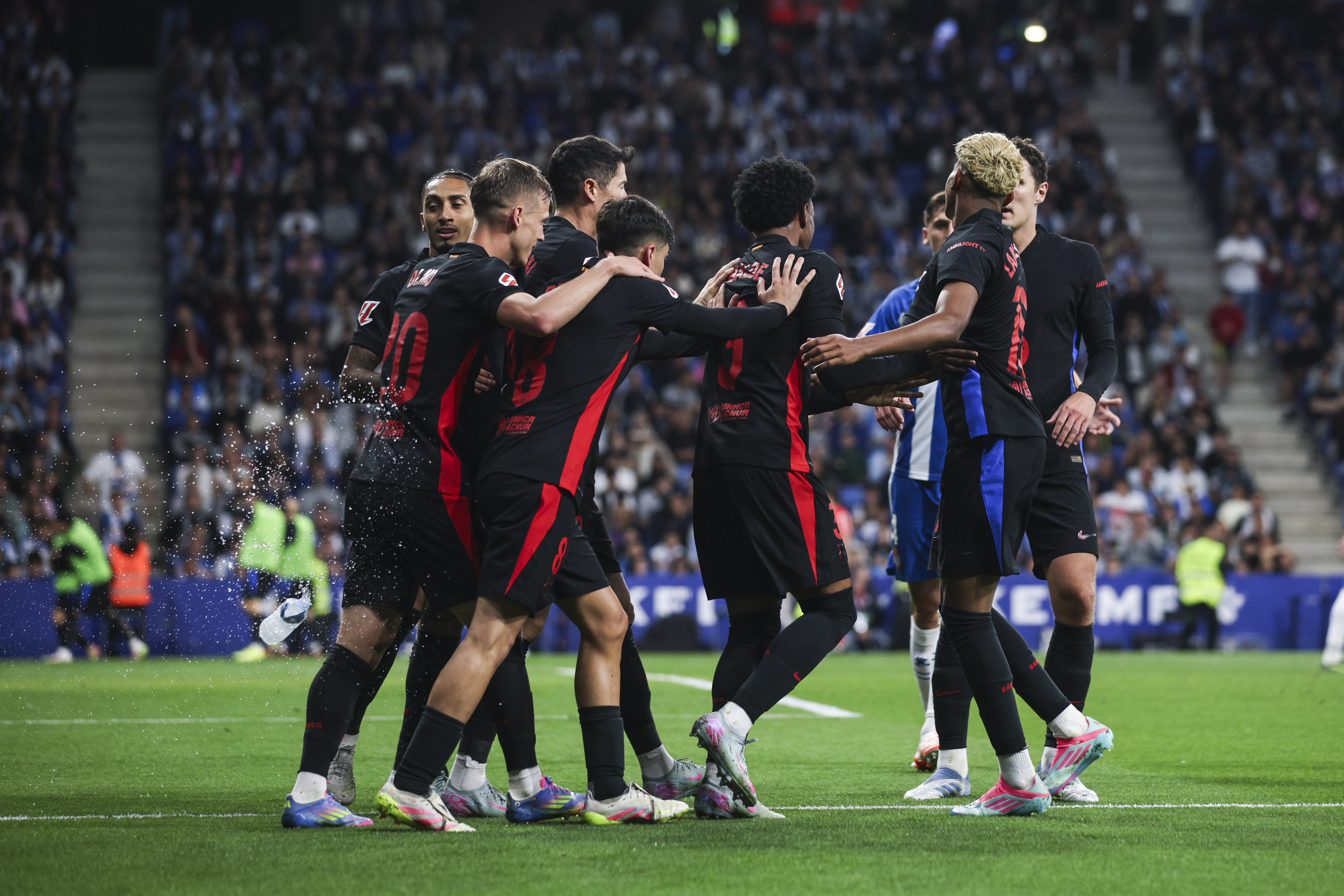 Barcelona&#039;s players celebrate after their victory over local rivals Espanyol in May